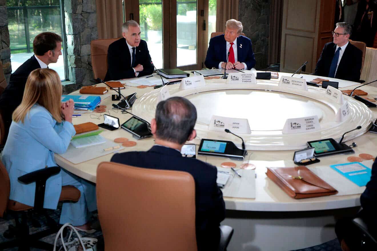 (Left to right) Italian Prime Minister Giorgia Meloni, French President Emmanuel Macron, Canadian Prime Minister Mark Carney, U.S. President Donald Trump and British Prime Minister Keir Starmer participate in a meeting with fellow G7 leaders at the G7 Leaders' Summit in Kananaskis, Alberta, on June 16, 2025. Photo by Chip Somodevilla/Getty Images.
