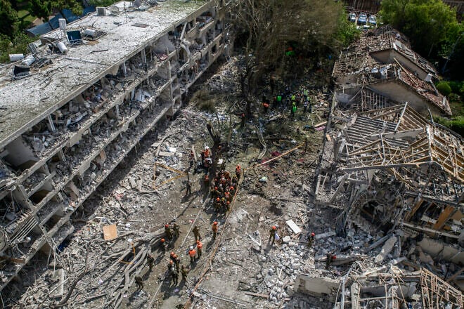 Israeli paramedics and forces at the scene of an Iranian ballistic missile impact in Tel Aviv, on June 22, 2025. Photo by Matan Golan/Middle East Images/AFP via Getty Images.