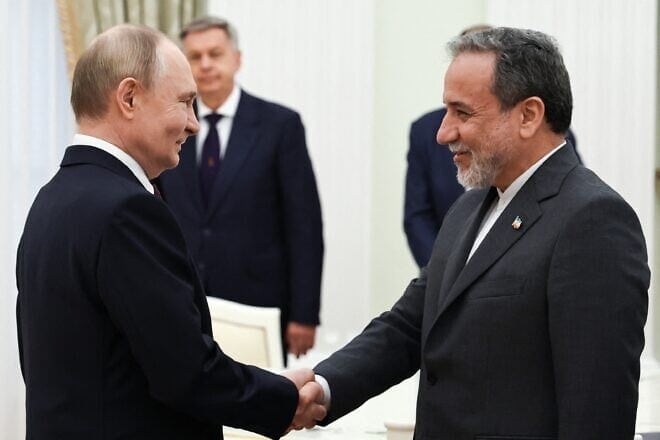 Russian President Vladimir Putin and Iranian Foreign Minister Abbas Araghchi shake hands during a meeting at the Kremlin in Moscow, on June 23, 2025. Photo by Alexander Kazakov/POOL/AFP via Getty Images.