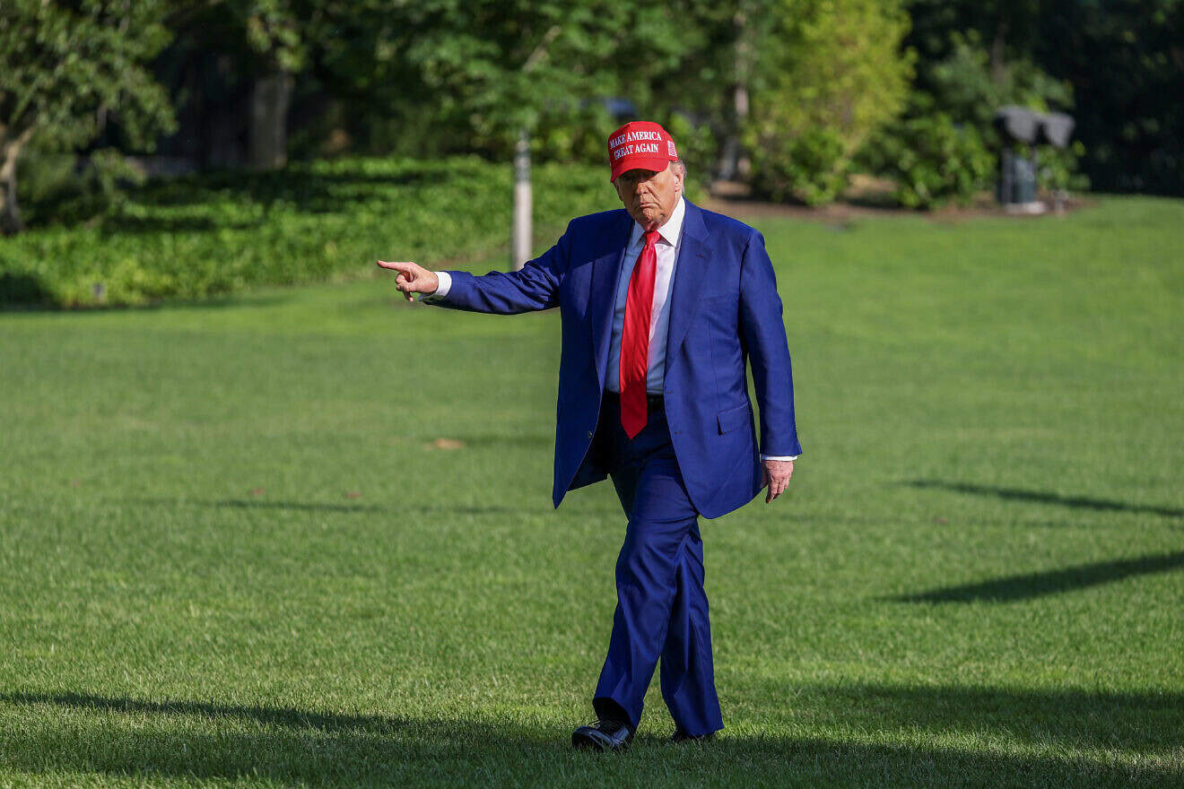 U.S. President Donald Trump points to a new flag on the south lawn of the White House on June 21, 2025 in Washington, DC. Photo by Tasos Katopodis/Getty Images.