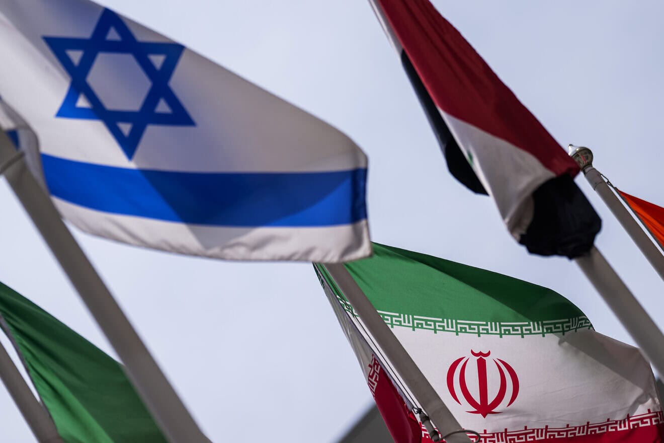 The flags of Iran and Israel are seen during a Board of Governors meeting of the International Atomic Energy Agency at IAEA headquarters in Vienna, on June 23, 2025. Photo by Christian Bruna/Getty Images.
