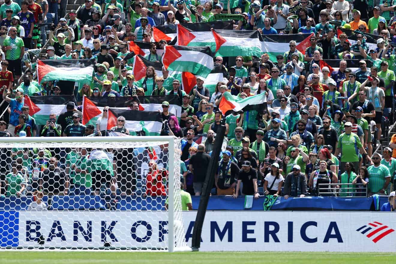 Fans raise Palestinian flags during the FIFA Club World Cup 2025 group B match between Seattle Sounders FC and Paris Saint-Germain FC, on June 23, 2025. Photo by Buda Mendes/Getty Images.