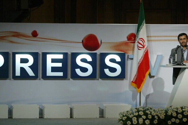 Iranian President Mahmoud Ahmadinejad delivers a speech during the inauguration ceremony for "Press TV," Iran's first English-language news channel, in Tehran, on July 2, 2007. Credit: STR/AFP via Getty Images.