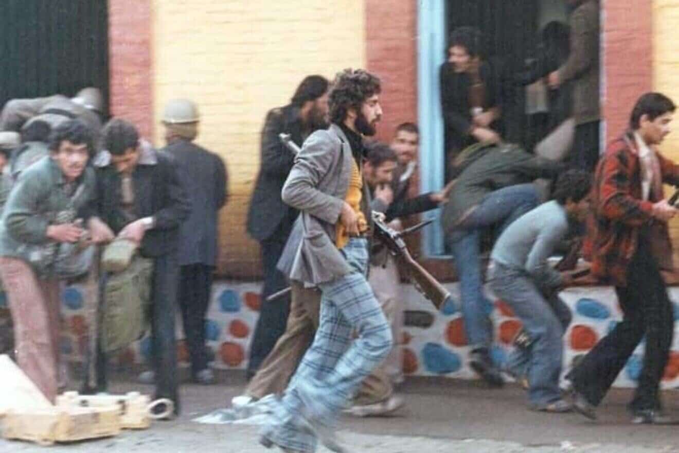 Armed revolutionaries during the Iranian Revolution in 1979. Credit: iichs.ir via Wikimedia Commons.