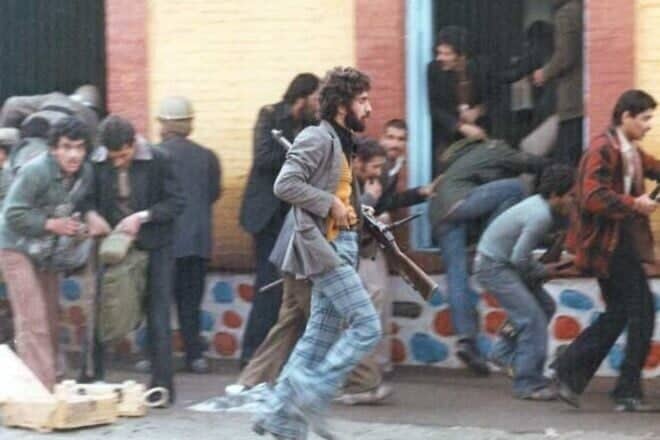 Armed revolutionaries during the Iranian Revolution in 1979. Credit: iichs.ir via Wikimedia Commons.