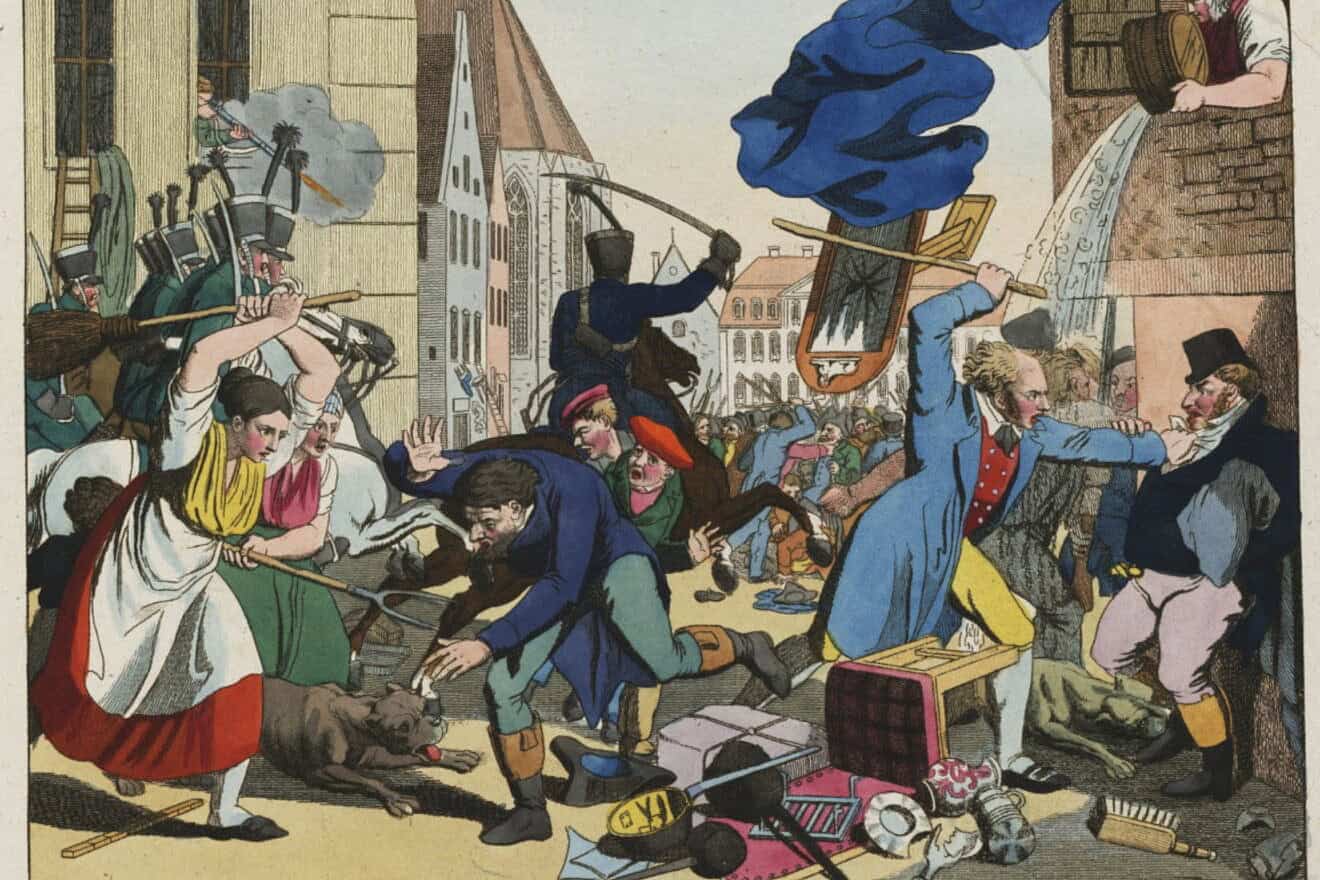 “Hep Hep” riots in in Würzburg, Germany, in 1819, from a contemporary engraving by Johann Michael Voltz. On the left, two peasant women are assaulting a Jew with pitchfork and broom. On the right, a man wearing tails and a six-button waistcoat, “perhaps a pharmacist or a schoolteacher,"” holds a Jew by the throat and is about to club him with a truncheon. The houses are being looted. Credit: Public Domain via Wikimedia Commons.