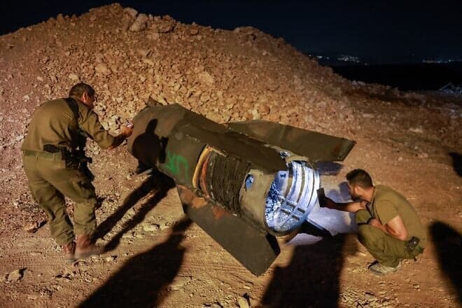 Israeli soldiers remove the remains of a ballistic missile fired from Iran in the northern Israeli city of Safed, June 16, 2025. Photo by David Cohen/Flash90.