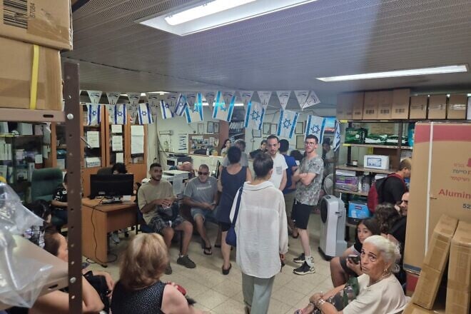 Individuals sheltered at Yad Sarah's Givatayim branch during an alarm warning of Iranian missiles. Credit: Courtesy.
