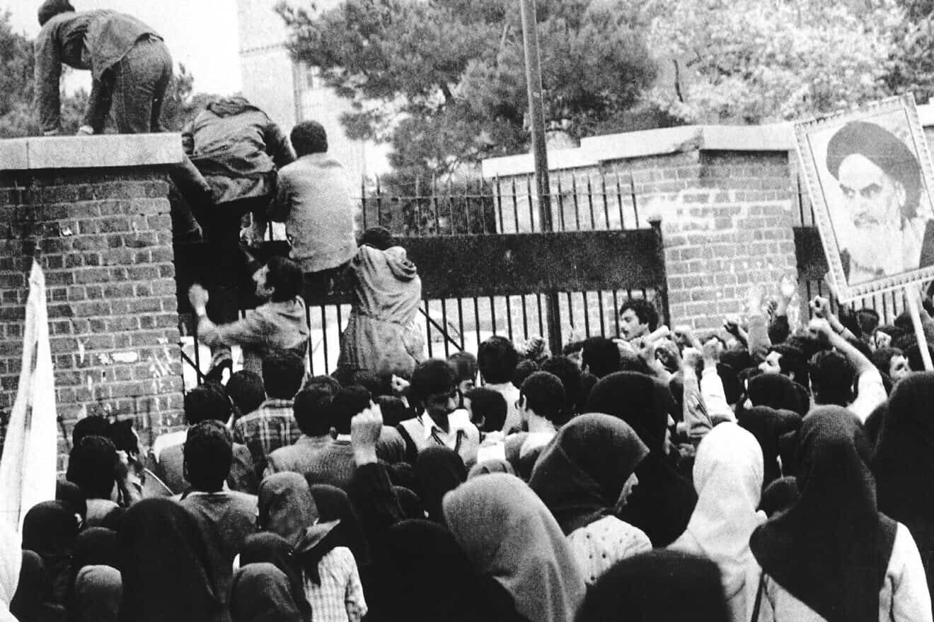 Iranian "students" storm the U.S. embassy in Tehran on Nov. 4, 1979. Unknown author via Wikimedia Commons.