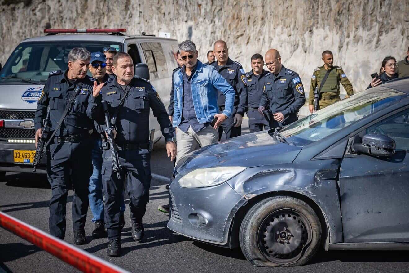 Then-Israel Police Commissioner Kobi Shabtai (front right) and the commander of the Judea and Samaria District of the Israel Police, Maj. Gen. Uzi Levy, at the scene of a terrorist shooting on Road 1 near Ma'ale Adumim in Judea, Feb. 22, 2024. Photo by Chaim Goldberg/Flash90.