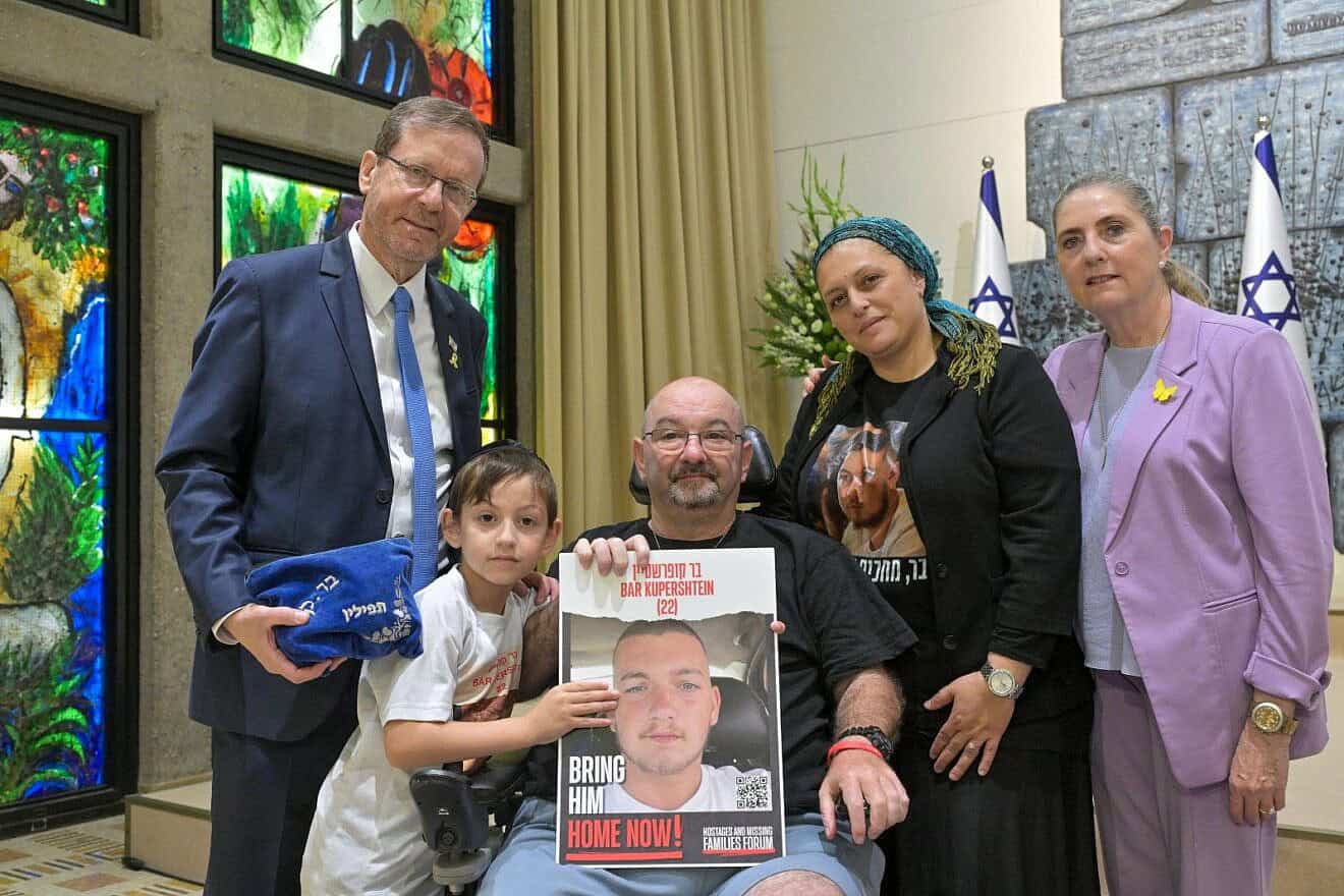 Bar Kupershtein's father, Tal, (c) and others at the “Tefillin for Every Hostage” project gathering at the President's House in Jerusalem, June 4, 2025. Photo by Kobi Gideon/GPO.