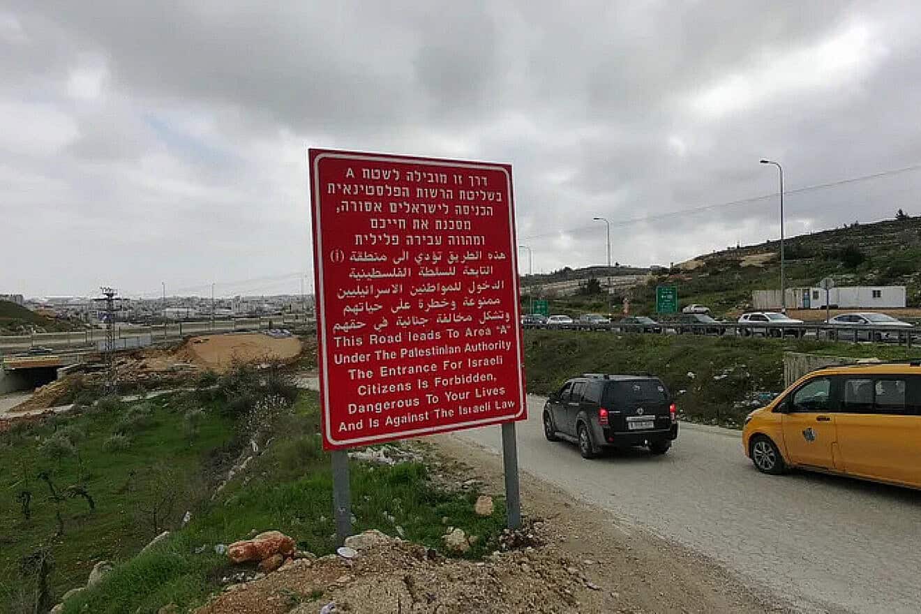 A road sign in Hebrew, Arabic and English barring Israeli entry into Area C. Photo by Daniel Rosehill.