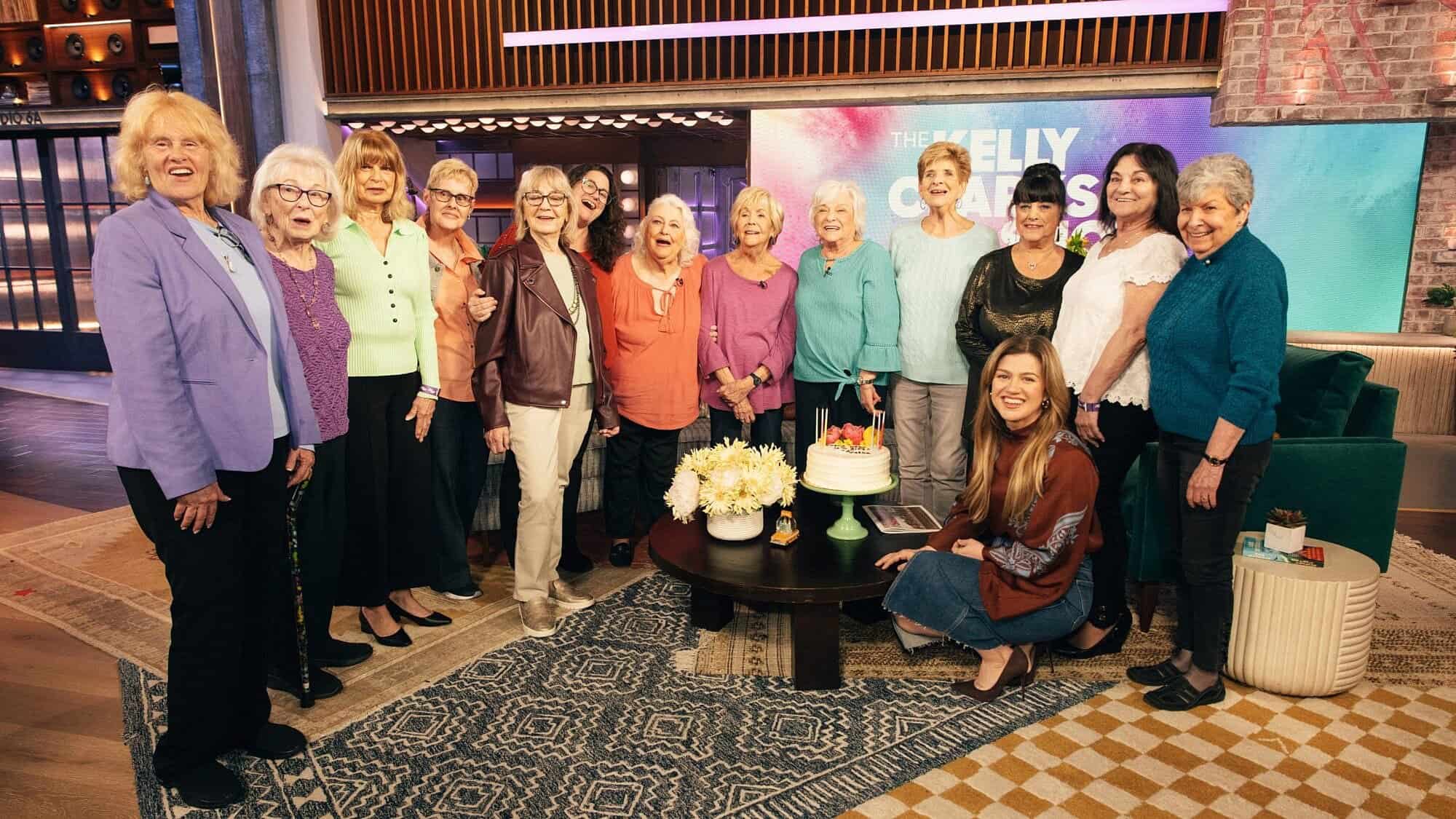 Women who reside in the Jack M. Satter House Hebrew SeniorLife residence in Revere, Mass., who modeled for the “Spectacular Seniors” 2025 calendar (project manager Rabbi Lior Nivo is sixth from left), are guests and VIPs on “The Kelly Clarkson Show,” April 24, 2025. Photo by Weiss Eubanks/NBCUniversal.