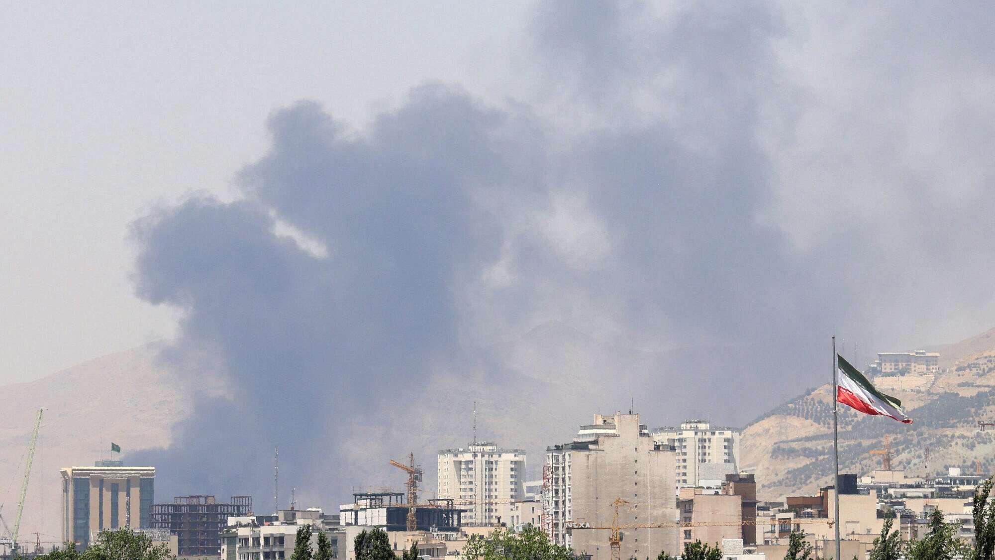 Smoke billows for the second day from the Shahran oil depot, northwest of Tehran, on June 16, 2025. Photo by Atta Kenare/AFP via Getty Images.