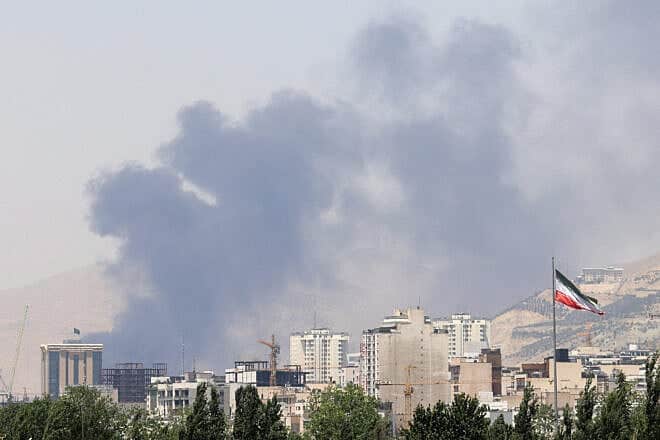 Smoke billows for the second day from the Shahran oil depot, northwest of Tehran, on June 16, 2025. Photo by Atta Kenare/AFP via Getty Images.