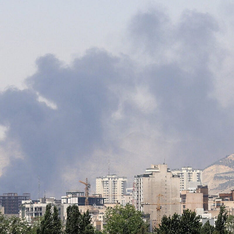 Smoke billows for the second day from the Shahran oil depot, northwest of Tehran, on June 16, 2025. Photo by Atta Kenare/AFP via Getty Images.