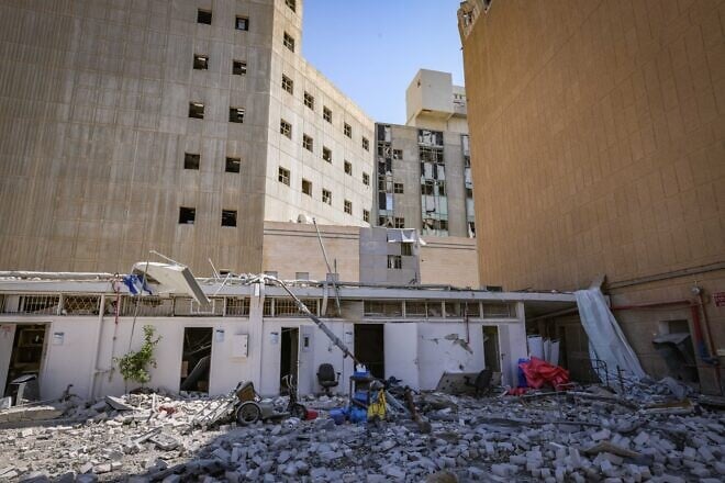 The scene where a ballistic missile fired from Iran hit and caused damage at the Soroka Medical Center in Beersheva, June 19, 2025. Photo by Marc Israel Sellem/POOL.