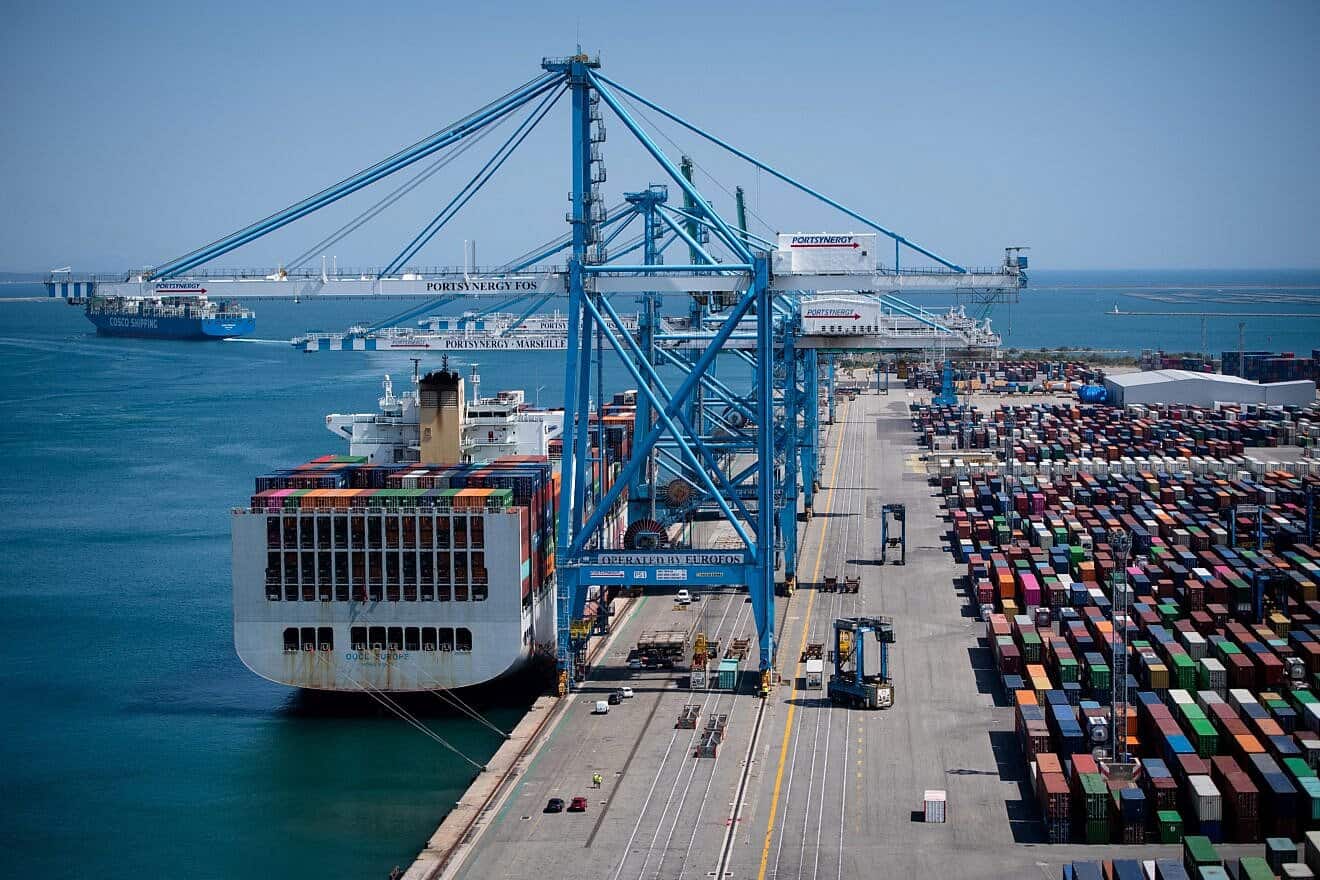A photograph taken from an industrial gantry crane shows shipping containers on the dock at EuroFos, France's largest container terminal, in the Fos-Sur-Mer harbor, as they are sorted by straddle carriers, July 23, 2020. Photo by Clement Mahoudeau/AFP via Getty Images.