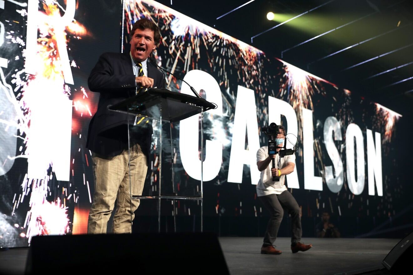 Conservative talk-show host Tucker Carlson speaks to attendees at the 2020 Student Action Summit hosted by Turning Point USA at the Palm Beach County Convention Center in West Palm Beach, Fla., Dec. 19, 2020. Credit: Gage Skidmore via Wikimedia Commons.