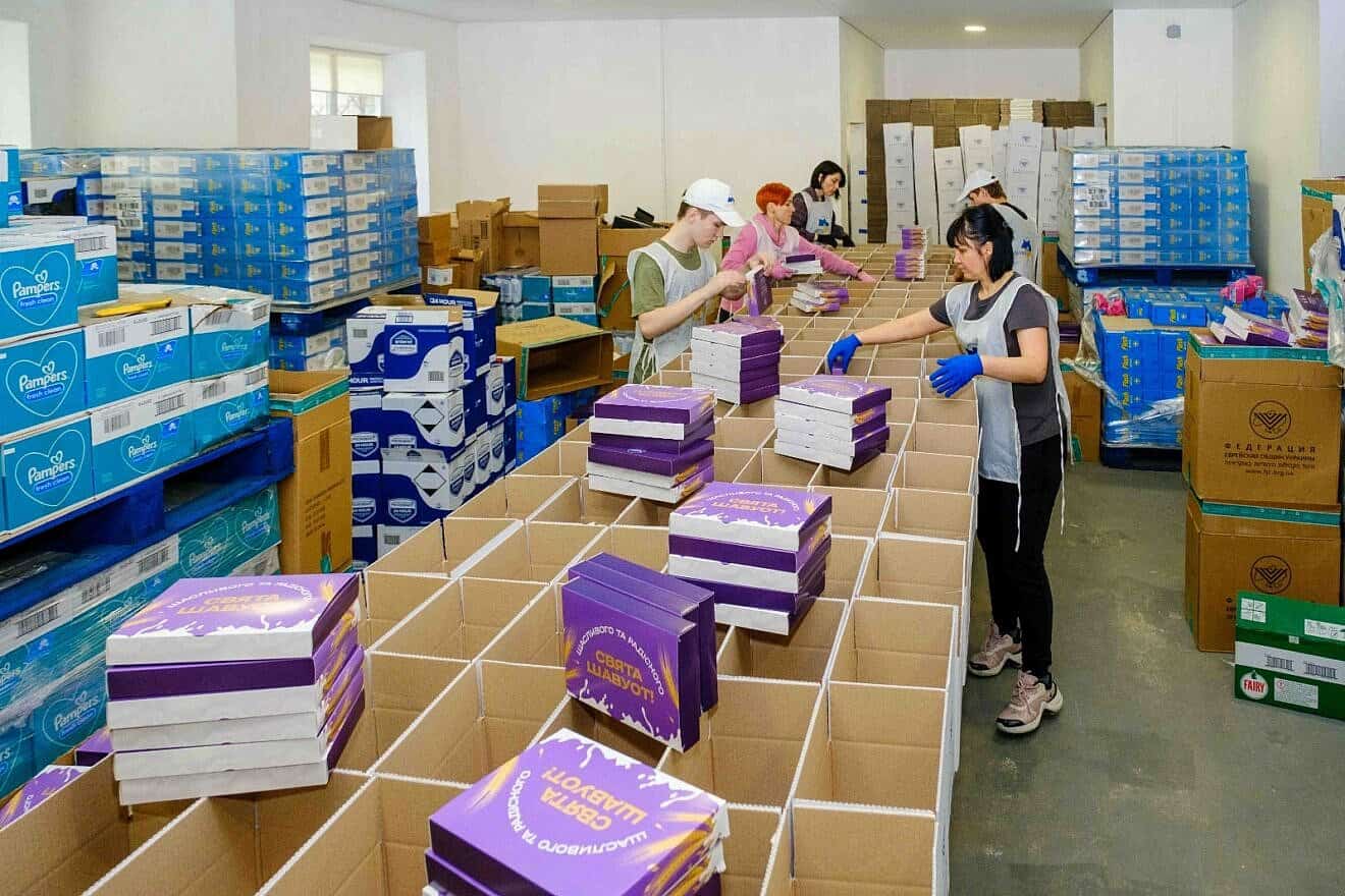 Staff prepare Shavuot packages for Ukrainian Jews in May 2025. Photo credit: FJCU.
