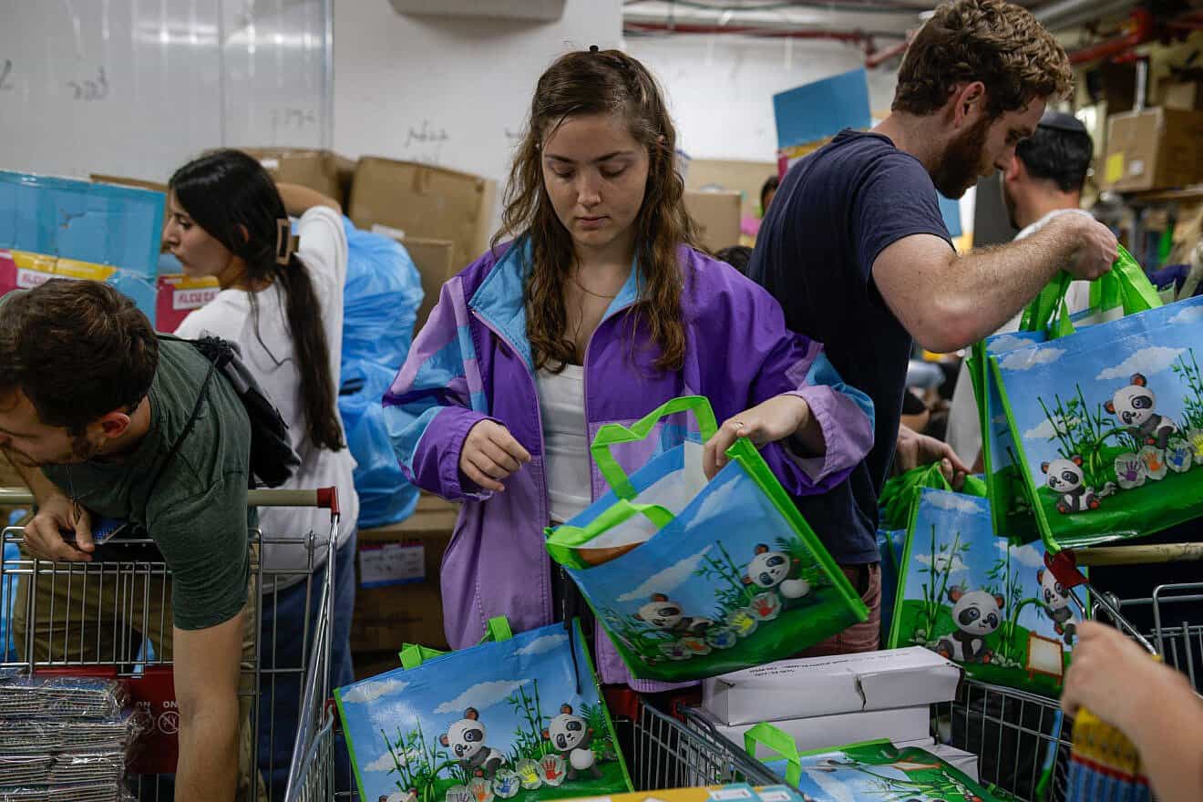 Young volunteers pack kits to distribute to young families in Jerusalem amid war between Israel and Iran, June 15, 2025. Photo by Rachel Alroey/Flash90.