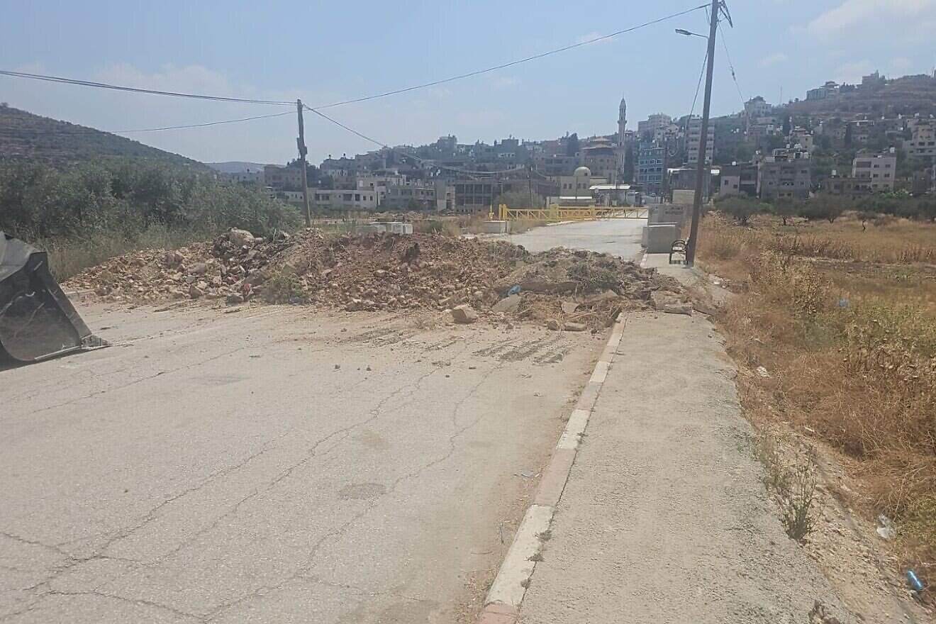 The blocked-off entrance to the Palestinian village of Al-Lubban ash-Sharqiya in the Binyamin region of Samaria, June 23, 2025. Credit: Courtesy.