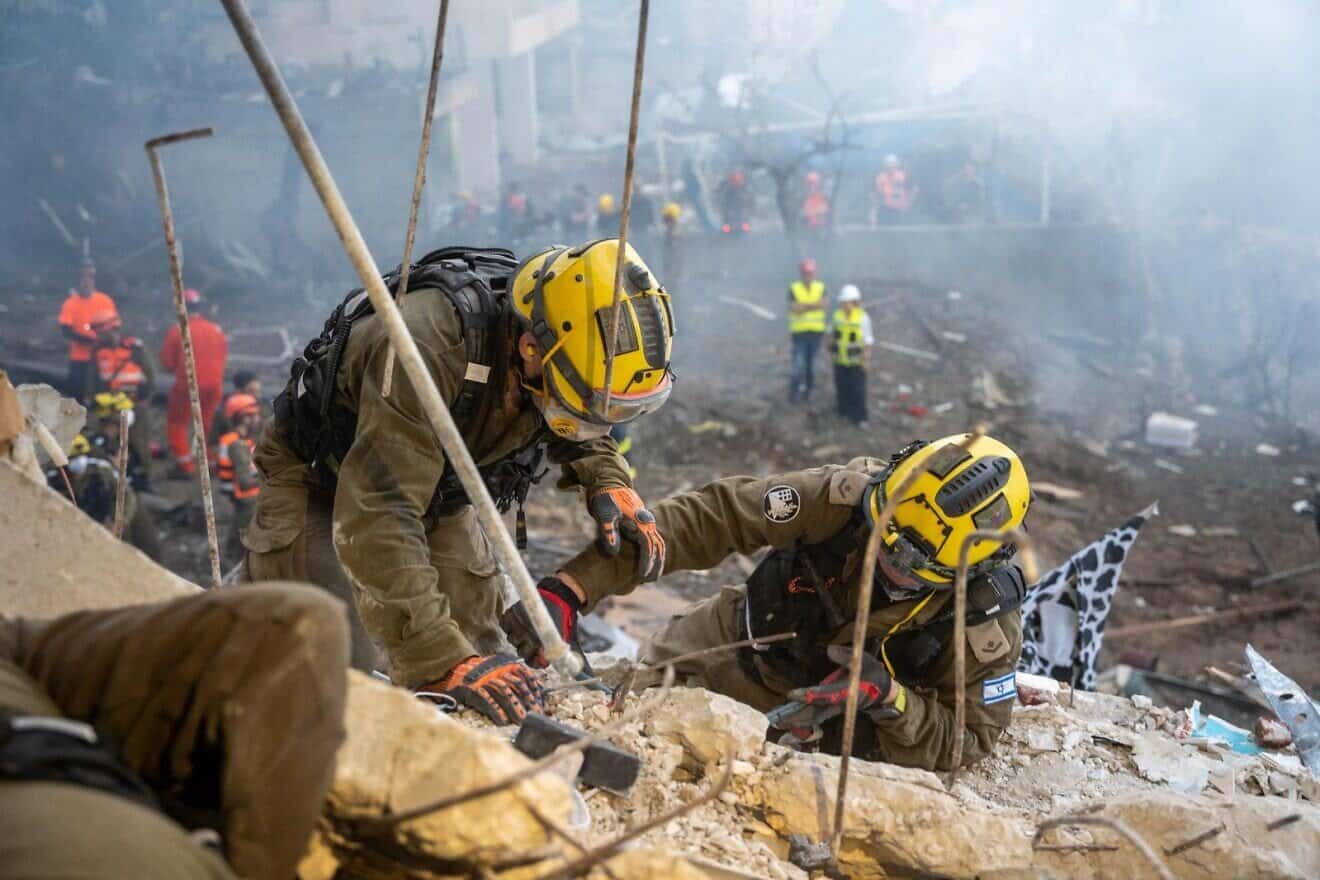 Troops of the IDF's Home Front Command in a scene impacted by a direct missile hit from Iran, during the 12-day “Operation Rising Lion” from June 13 to June 24. Credit: IDF.