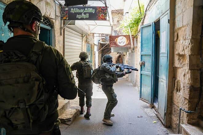 Israeli forces conduct a counterterrorism operation in the Kasbah of Nablus, searching structures and apprehending suspects as part of Operation Iron Walls. Credit: IDF.
