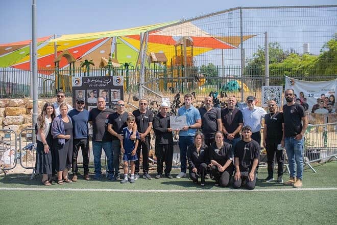 A delegation from the Christian student organization Passages visits the soccer field in the Druze community of Majdal Shams on the Golan Heights, Israel, that was the site of a deadly Hezbollah rocket attack last year, June 11, 2025. Credit: Credit: Joshua Aarum.