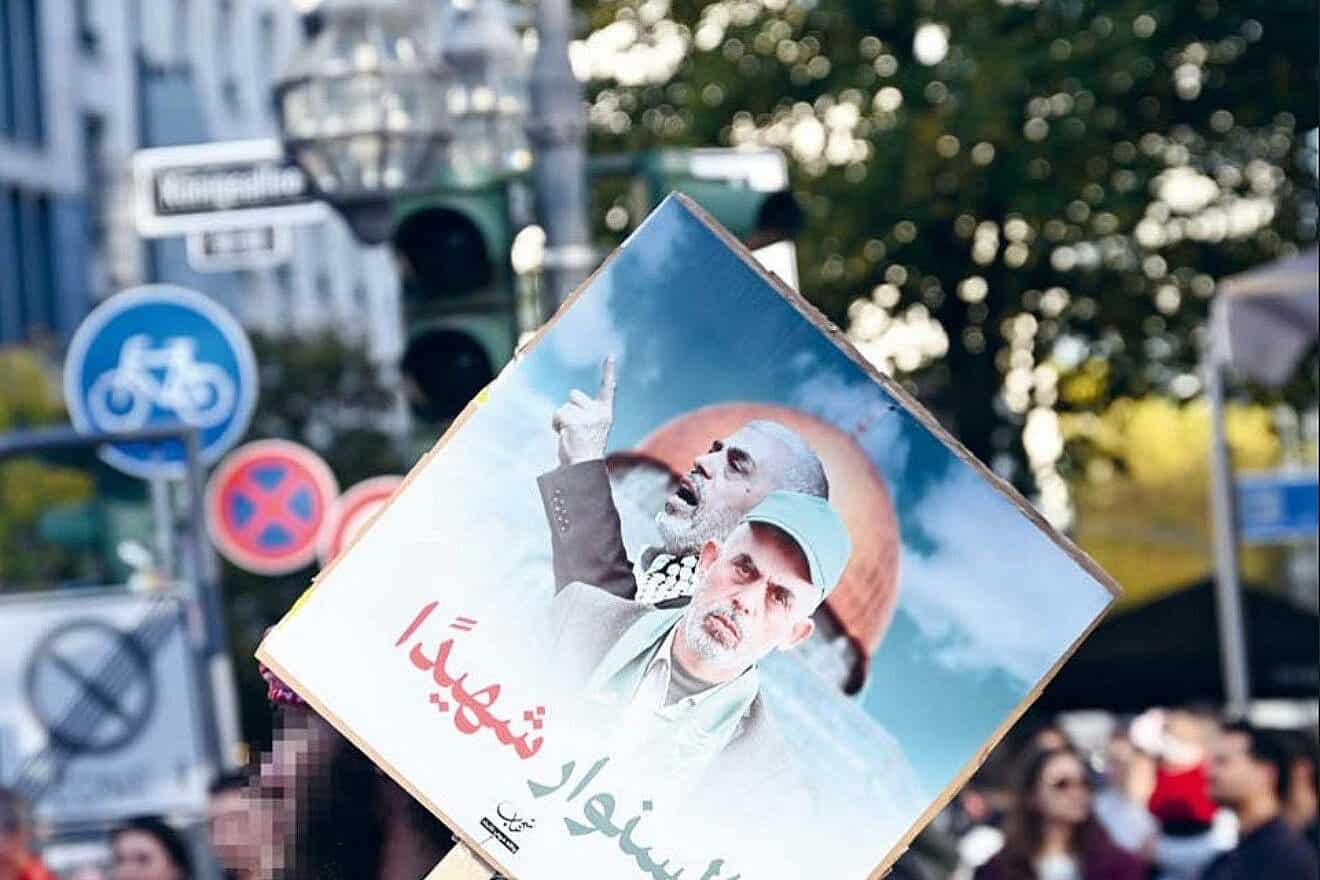 Protesters at an anti-Israel rally hold up a poster celebrating Hamas leader Yahiya Sinwar in Dusseldorf, Germany in October 2024. Photo courtesy of RIAS.