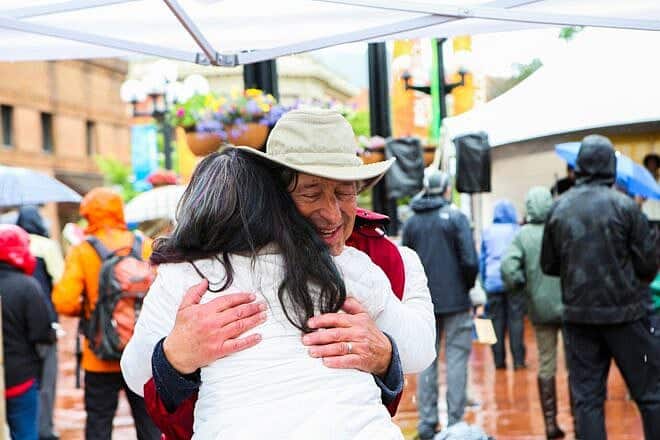 A man hugs a woman at the 2024 Jewish festival in Boulder, Colorado. Photo Credit: The Boulder Jewish Festival.
