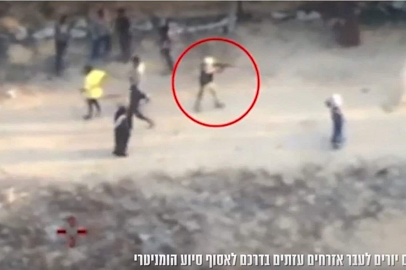 A screen capture from a video released Sunday, reportedly showing a Gazan gunman firing at civilians in Khan Yunis on June 1, 2025. Screenshot: IDF Spokesperson's Unit.