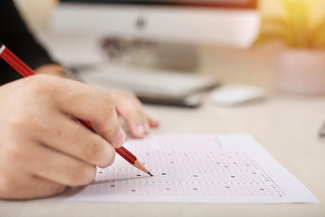 Student filling out a test answer sheet. Credit: F1Digitals/Pixabay.