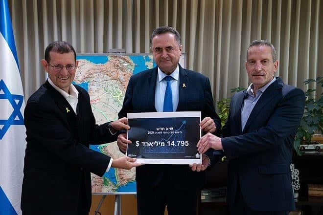 Director General of the Israeli Defense Ministry, Maj. Gen. (Res.) Amir Baram (right), and Head of the Defense Ministry's International Defense Cooperation Directorate, Brig. Gen. (Res.) Yair Kulas (left), present the 2024 defense exports report to Israeli Defense Minister Israel Katz at Defense Ministry headquarters in Tel Aviv, Israel, on June 4, 2025. Credit: Israel Defense Ministry.