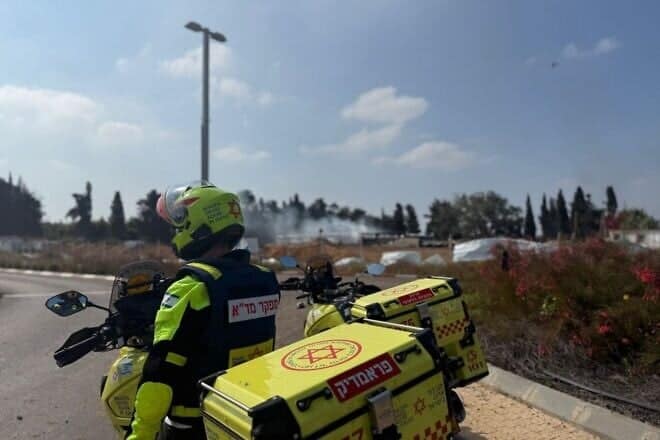 A Magen David Adom rescuer assesses damage and provides emergency assistance at an attack site in central Israel following Iran's missile strike on June 17, 2025. Credit: MDA.