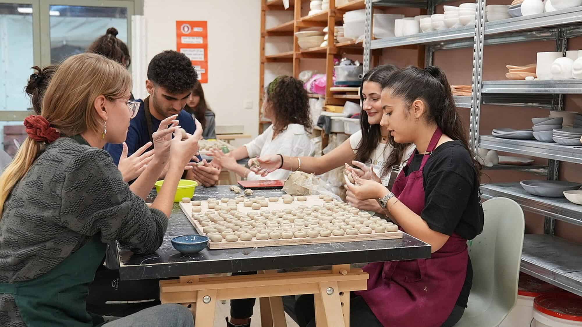 Participating youth at work in the Quantum program, creating custom items to be sold. Credit: Courtesy of Goldie Sternbuch.