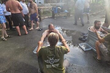 ZAKA volunteers experience cold plunge therapy at a retreat in Israel on July 1, 2025. Credit: ZAKA.
