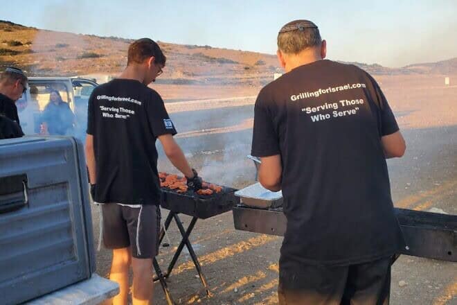 Grilling for Israel volunteers barbecue at an IDF base in southern Israel on July 16, 2025. Credit: Grilling for Israel.