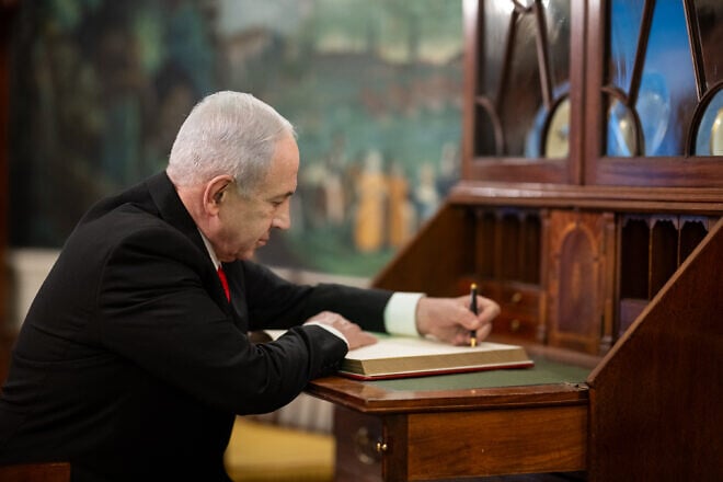 Israeli Prime Minister Benjamin Netanyahu signs the guest book in the White House, July 7, 2025. Credit: Daniel Torok/White House.