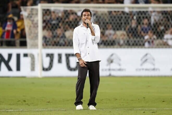 French-Israeli singer Laurent Amir Haddad, also known as Amir, performs before the start of the French Champions' Trophy final soccer match between Paris Saint-Germain and Lille at Bloomfield Stadium in Jaffa, on Aug. 1, 2021. Photo by Emmanuel Dunand/AFP via Getty Images.