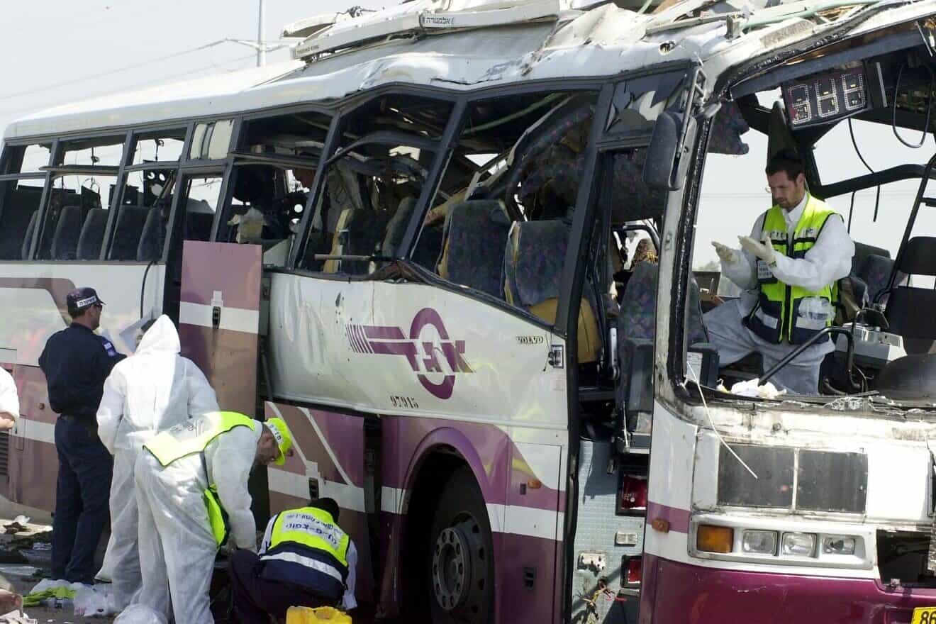An Egged No. 960 bus near the Yagur Junction, southeast of Haifa, after a Palestinian suicide bomber blew himself up on April 10, 2002. Credit: IDF Spokesperson's Unit via Wikimedia Commons.