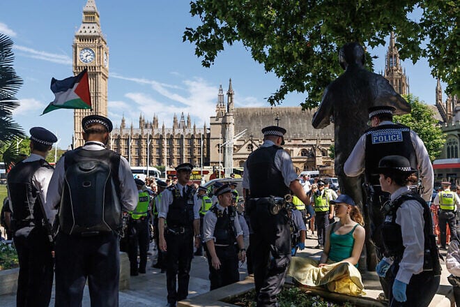 A protester is arrested at Parliament Square in London as people rally against Palestine Action's proscription as a terrorist organization, July 12, 2025. Photo by Dan Kitwood/Getty Images.