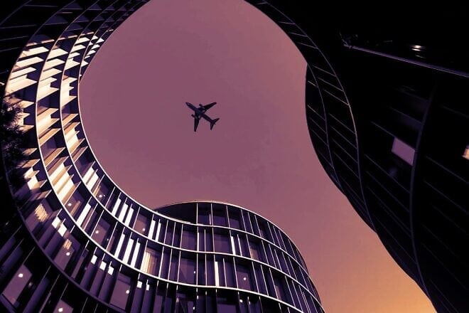 A plane flies over Copenhagen, Denmark. Credit: Sushil Ghimire/Pexels.