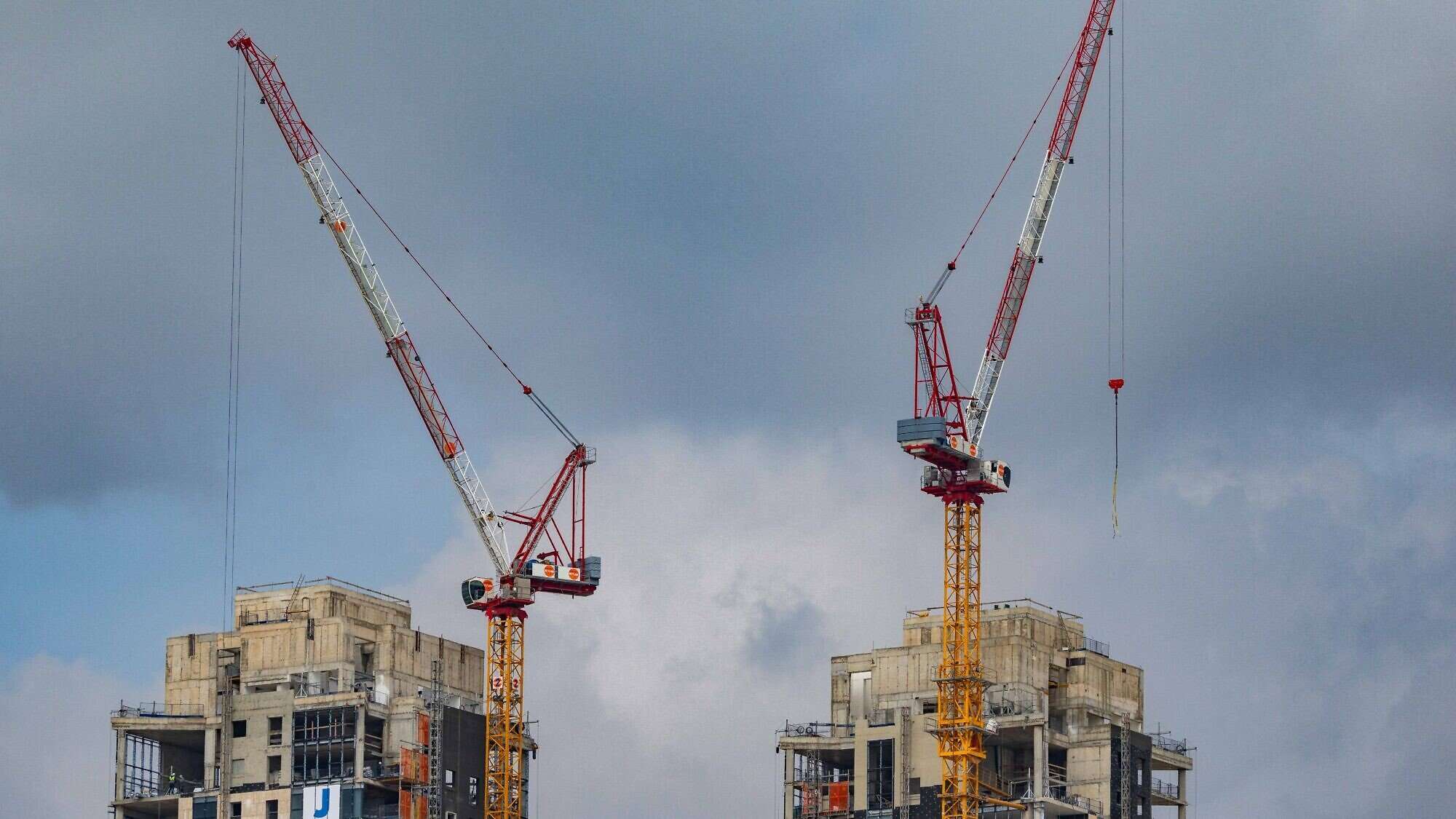 Cranes working at a construction site in Jerusalem, Feb. 19, 2025. Photo by Nati Shohat/Flash90.