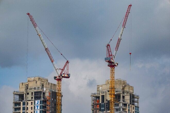 Cranes working at a construction site in Jerusalem, Feb. 19, 2025. Photo by Nati Shohat/Flash90.