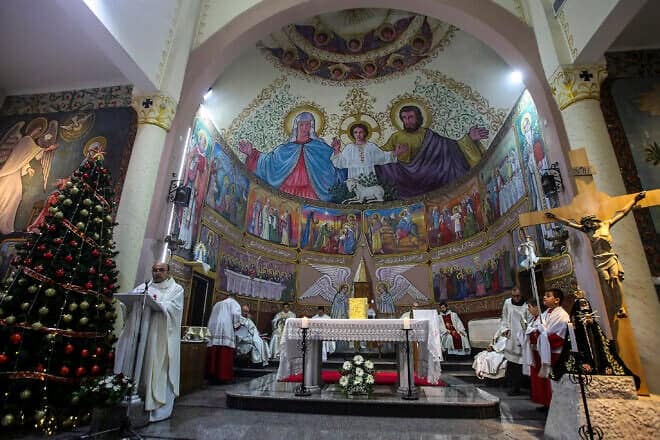 A mass in Gaza City's Holy Family Church during the start of the Christmas holiday, Dec. 19, 2021. Photo by Atia Mohammed/Flash90.