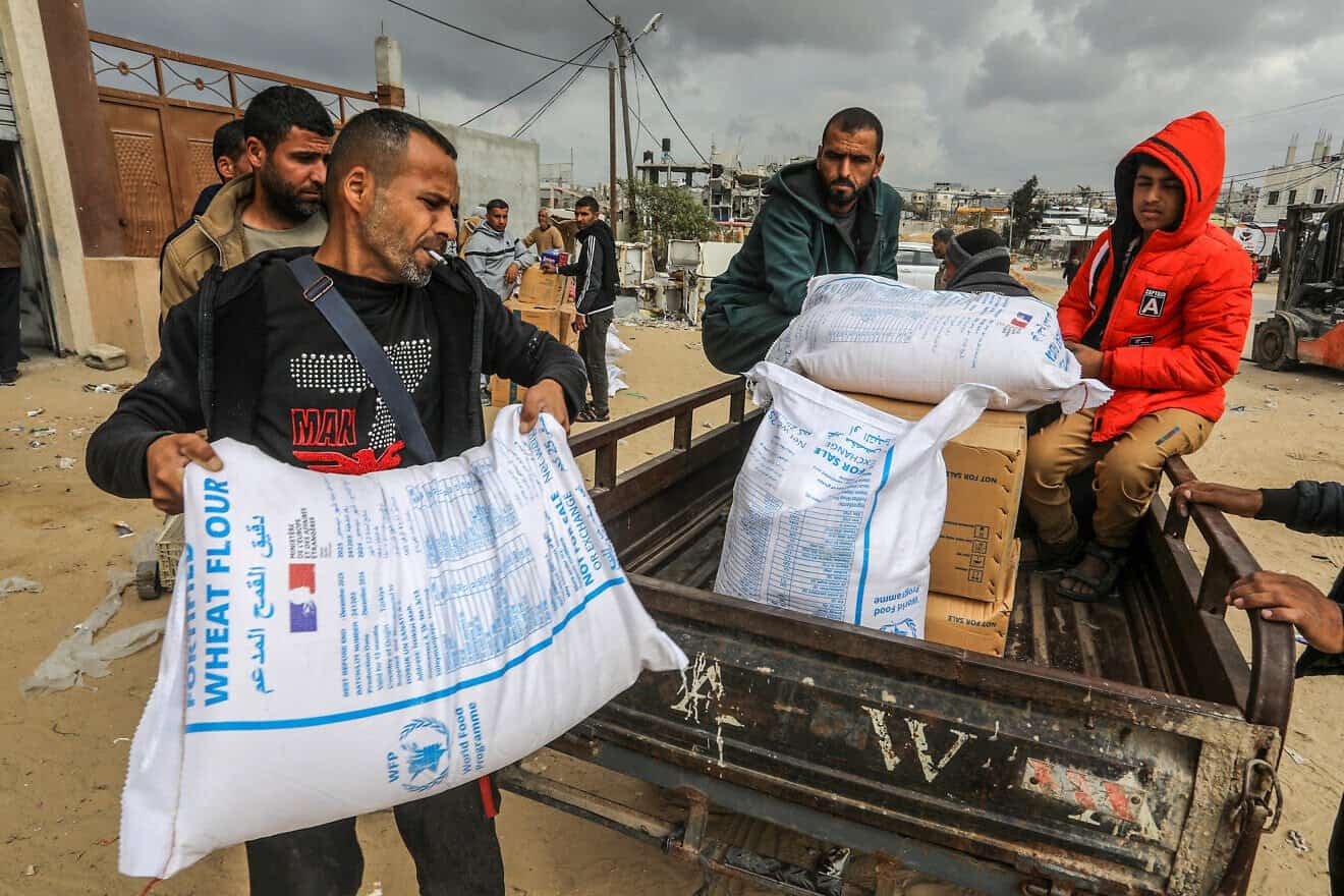 Palestinians receive food aid from the World Food Program in cooperation with the U.N. Relief and Works Agency (UNRWA) in Khan Yunis, in the southern Gaza Strip, on Feb. 19, 2025. Photo by Abed Rahim Khatib/Flash90.