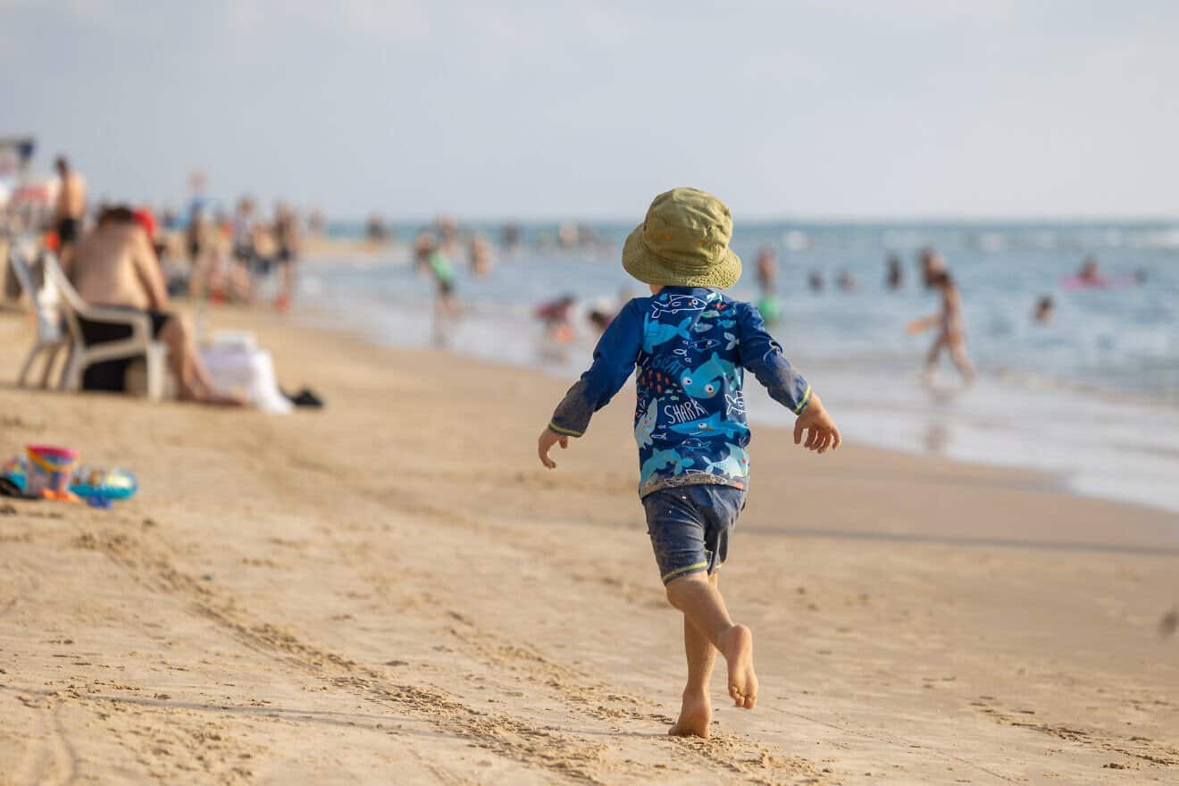 People enjoy the beach in Bat Yam in central Israel, July 25, 2025. Photo by Dor Pazuelo/Flash90.