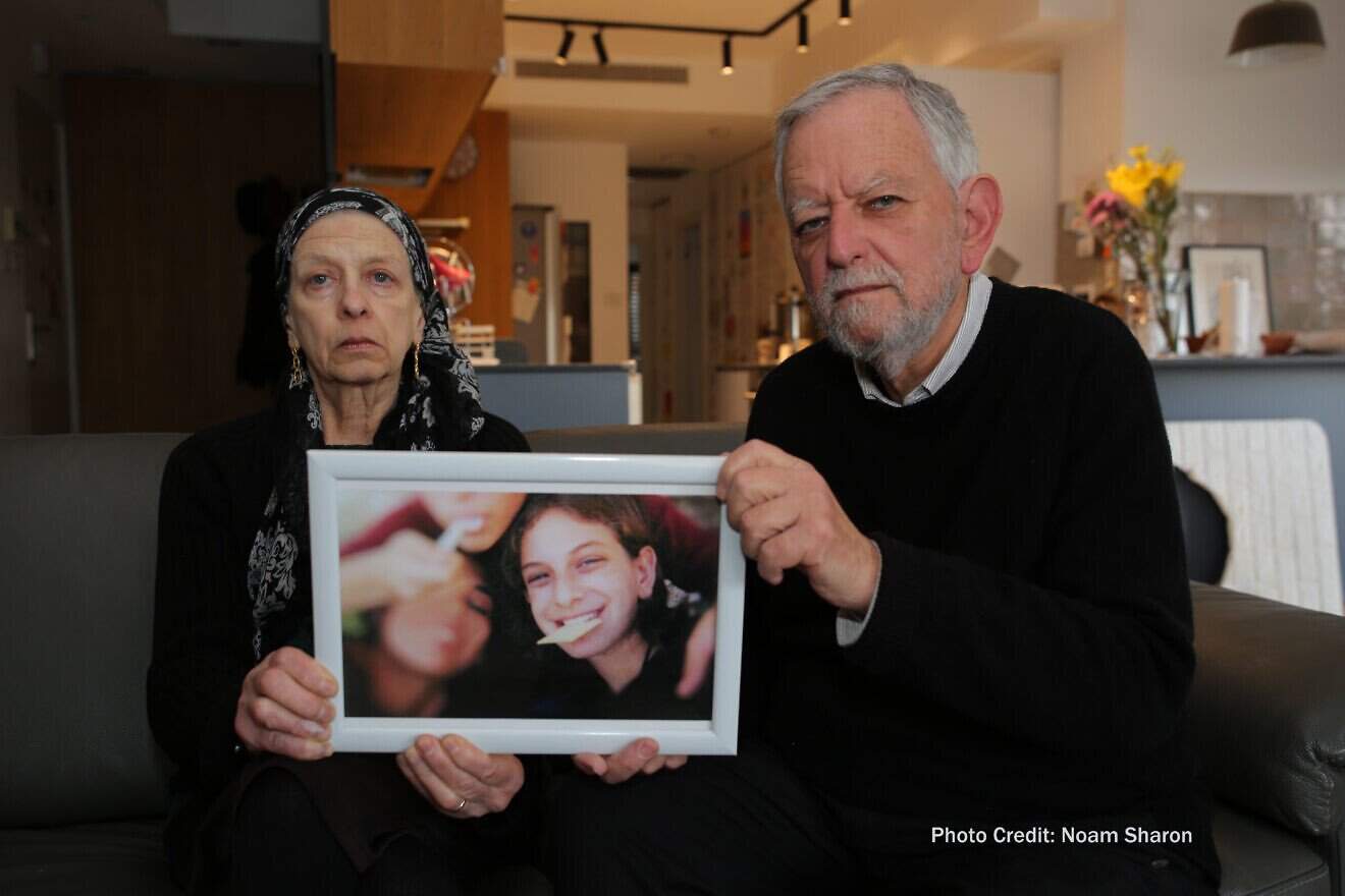 Arnold Roth and his wife, Frimet, hold a picture of their murdered daughter Malki. July 15, 2025. Photo by Noam Sharon.