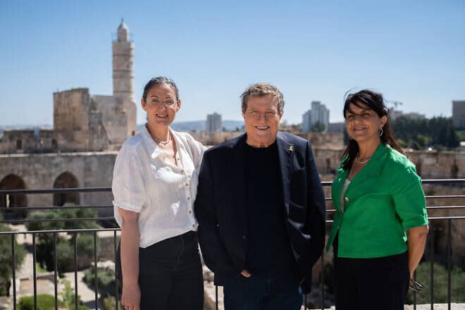 Yehoram Gaon at the Tower of David Jerusalem, flanked by exhibition curator Tal Kobo (L) and Eilat Lieber, the museum’s director and chief curator, July 10, 2025. Photo by Gil Volfson.